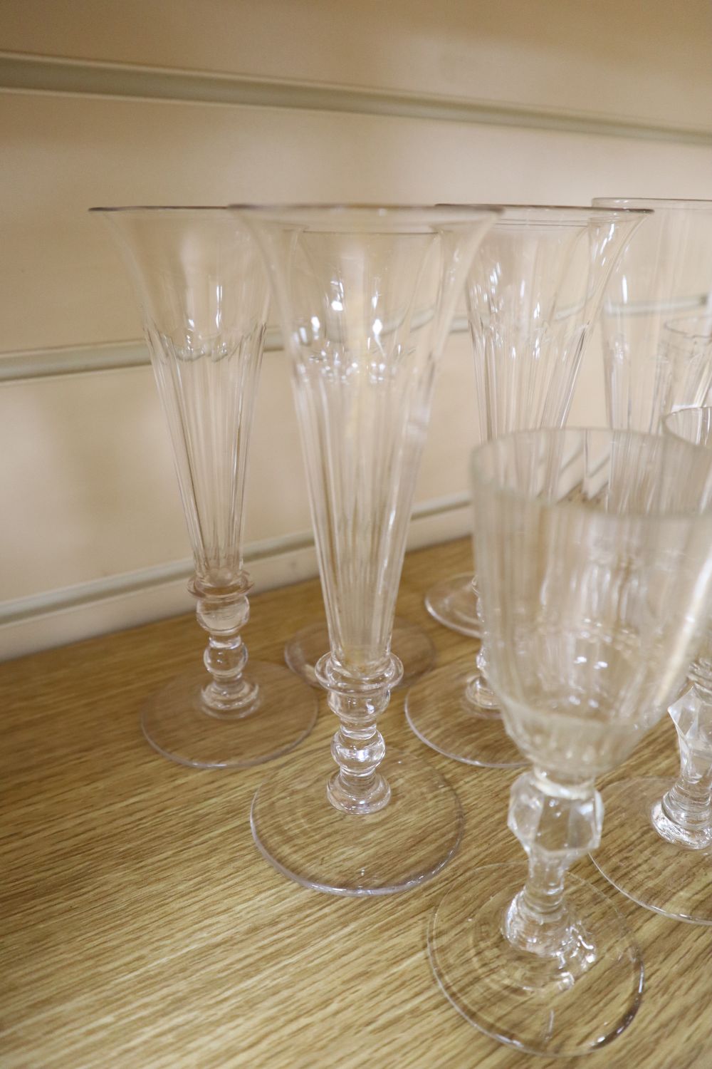 A group of four mid 19th century glass rummers, various cut glass champagne flutes etc.